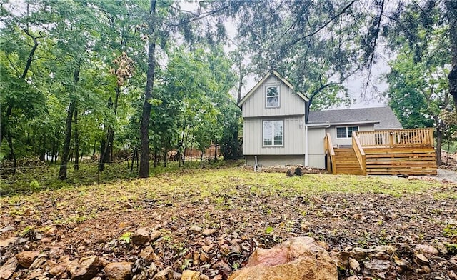 10057 Otter Rd, Clinton, MO 64735 - rear view of property with a wooden deck and stairs