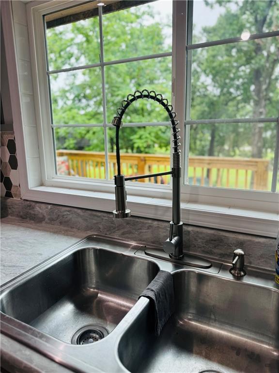 10057 Otter Rd, Clinton, MO 64735 - kitchen view of a sink and backsplash