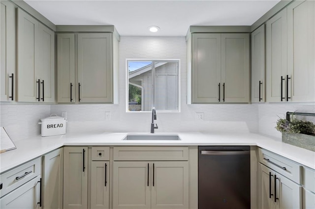 11917 W 66th St, Shawnee, KS 66216 - kitchen with stainless steel dishwasher, backsplash, gray cabinetry, light countertops, and recessed lighting