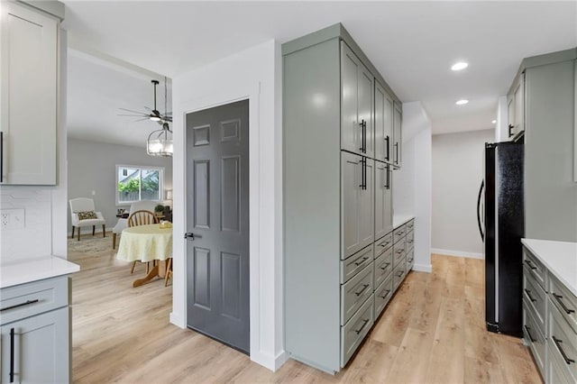 11917 W 66th St, Shawnee, KS 66216 - kitchen with freestanding refrigerator, gray cabinetry, a ceiling fan, light countertops, and recessed lighting