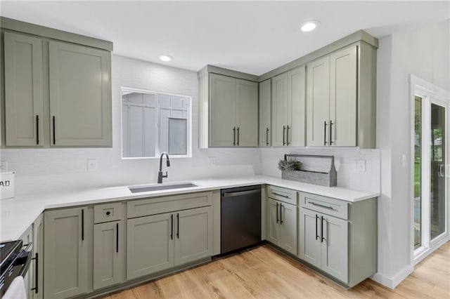 11917 W 66th St, Shawnee, KS 66216 - kitchen featuring stainless steel appliances, backsplash, healthy amount of natural light, light wood-style flooring, and recessed lighting