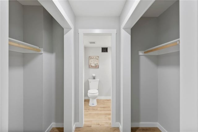 11917 W 66th St, Shawnee, KS 66216 - walk in closet with wood finished floors