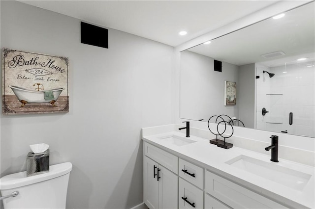 11917 W 66th St, Shawnee, KS 66216 - bathroom with double vanity, a shower, and recessed lighting