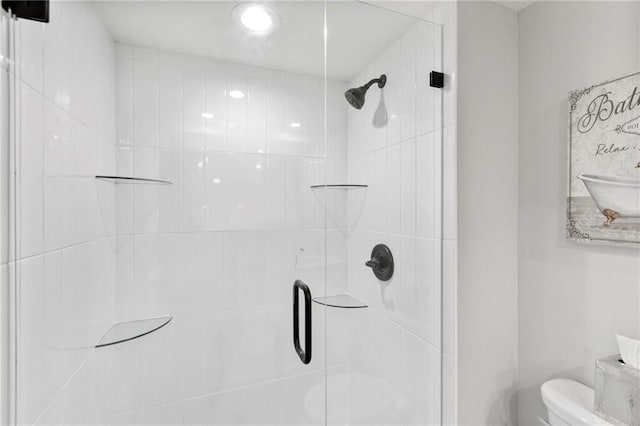 11917 W 66th St, Shawnee, KS 66216 - bathroom featuring toilet and a shower stall
