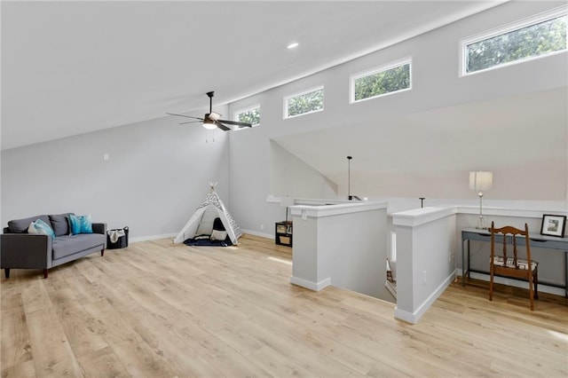 11917 W 66th St, Shawnee, KS 66216 - unfurnished room with an upstairs landing, ceiling fan, wood finished floors, and recessed lighting