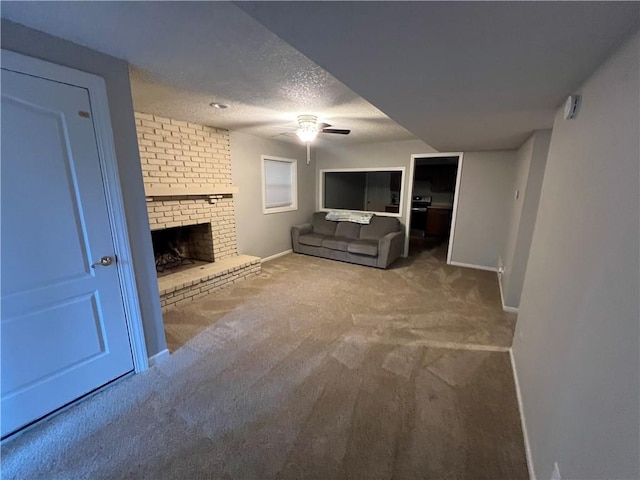 8237 N Chatham Ave, Kansas City, MO 64151 - unfurnished living room with ceiling fan, carpet flooring, a textured ceiling, a fireplace, and baseboards
