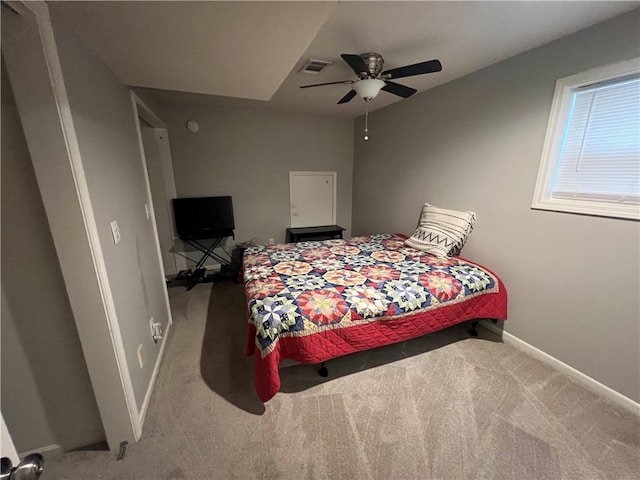 8237 N Chatham Ave, Kansas City, MO 64151 - carpeted bedroom with baseboards and a ceiling fan