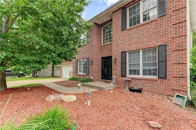 3403 E Devonshire Dr, Saint Joseph, MO 64506 - view of front of property featuring brick siding and an attached garage