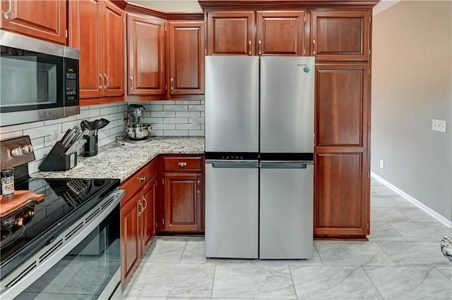 3403 E Devonshire Dr, Saint Joseph, MO 64506 - kitchen with appliances with stainless steel finishes, light marble finish flooring, backsplash, and baseboards