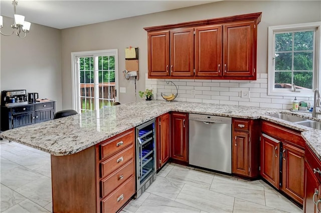 3403 E Devonshire Dr, Saint Joseph, MO 64506 - kitchen with stainless steel dishwasher, a peninsula, wine cooler, a sink, and light marble finish flooring