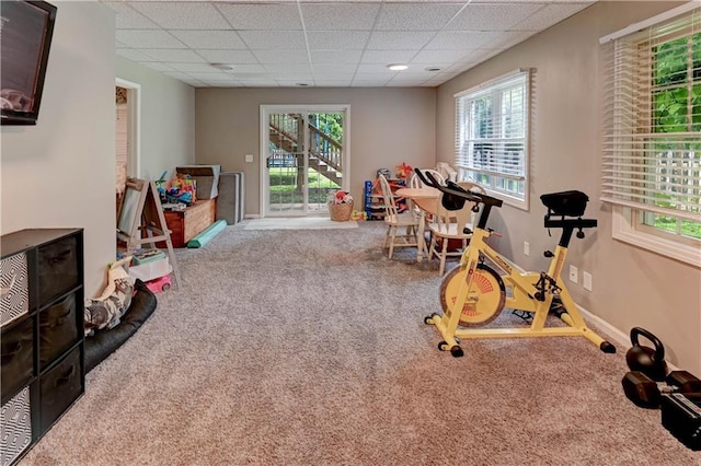 3403 E Devonshire Dr, Saint Joseph, MO 64506 - recreation room featuring carpet flooring, a paneled ceiling, plenty of natural light, and baseboards