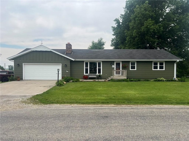 605 Queen St, King City, MO 64463 - ranch-style house featuring concrete driveway, an attached garage, a front lawn, and a chimney