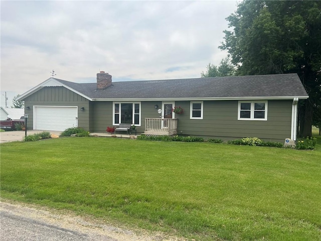 605 Queen St, King City, MO 64463 - ranch-style house with a chimney, an attached garage, concrete driveway, and a front lawn