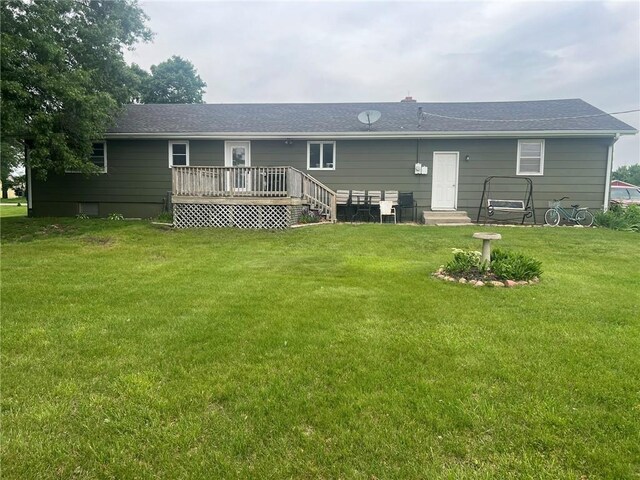 605 Queen St, King City, MO 64463 - rear view of house featuring a deck, a lawn, and roof with shingles