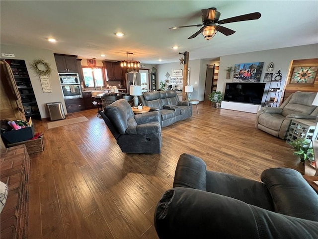 605 Queen St, King City, MO 64463 - living room with wood finished floors, a ceiling fan, and recessed lighting