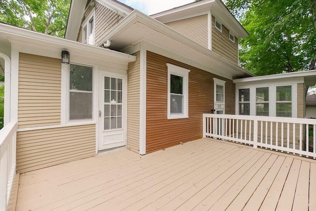 812 E Wabash St, Olathe, KS 66061 - wooden deck with a sunroom