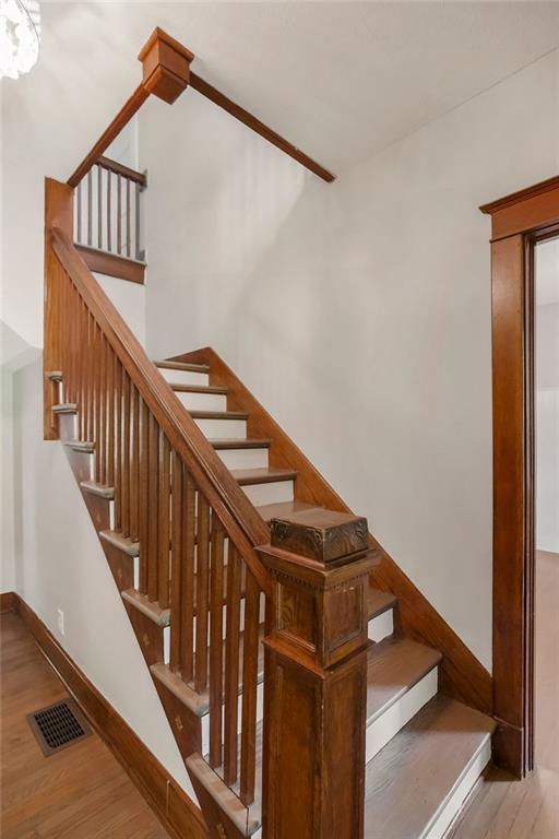 812 E Wabash St, Olathe, KS 66061 - staircase featuring wood finished floors