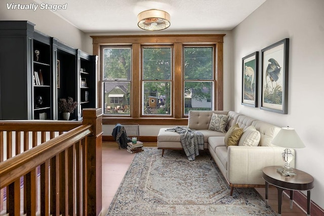 812 E Wabash St, Olathe, KS 66061 - living area with baseboards and wood finished floors