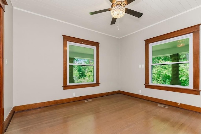 812 E Wabash St, Olathe, KS 66061 - empty room featuring wood finished floors, crown molding, and a ceiling fan