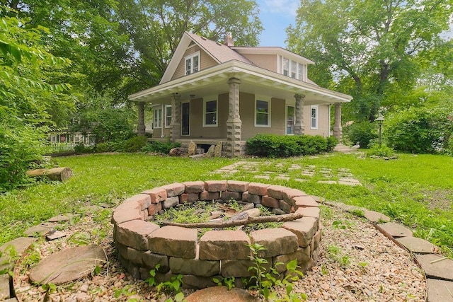 812 E Wabash St, Olathe, KS 66061 - view of front facade featuring an outdoor fire pit, covered porch, and a front yard