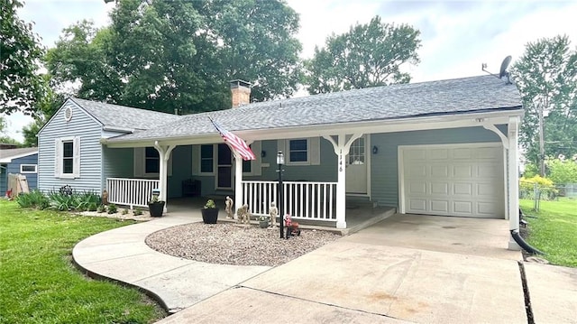 1146 S Willow St, Ottawa, KS 66067 - ranch-style home with a porch, an attached garage, a chimney, a front yard, and concrete driveway
