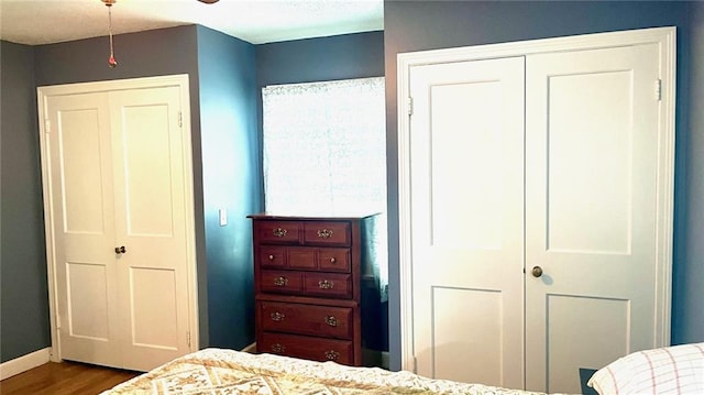 1146 S Willow St, Ottawa, KS 66067 - bedroom featuring dark wood finished floors, a closet, and baseboards