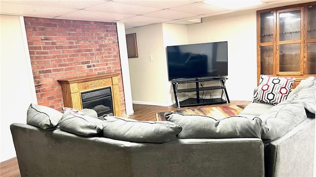 1146 S Willow St, Ottawa, KS 66067 - living room with wood finished floors, a fireplace, and baseboards