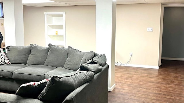 1146 S Willow St, Ottawa, KS 66067 - living room with a drop ceiling, built in features, baseboards, and wood finished floors