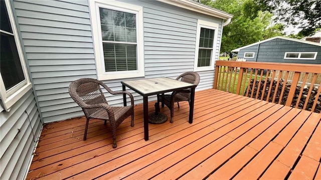 1146 S Willow St, Ottawa, KS 66067 - wooden deck featuring outdoor dining area