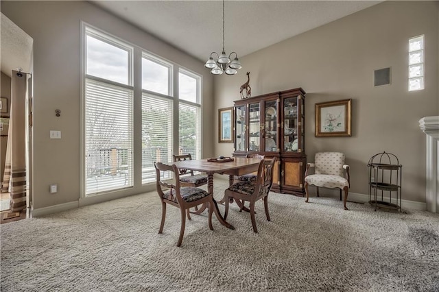 12207 England St, Overland Park, KS 66213 - dining area featuring carpet flooring, a chandelier, plenty of natural light, and baseboards