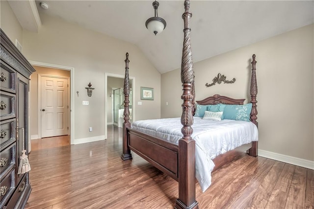 12207 England St, Overland Park, KS 66213 - bedroom featuring wood finished floors, lofted ceiling, and baseboards