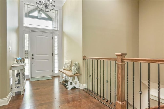 16570 S Ingrid St, Gardner, KS 66030 - entryway with wood-type flooring, a chandelier, and a high ceiling