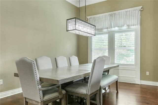 16570 S Ingrid St, Gardner, KS 66030 - dining area featuring baseboards, wood finished floors, and a chandelier