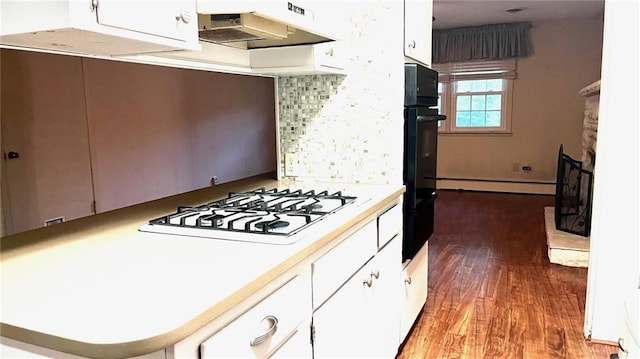 1441 S Maple St, Ottawa, KS 66067 - kitchen with white gas stovetop, range hood, wood finished floors, and white cabinetry