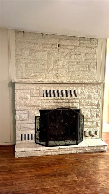 1441 S Maple St, Ottawa, KS 66067 - detailed view of a stone fireplace and wood finished floors