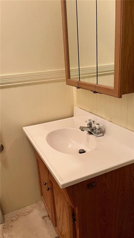 1441 S Maple St, Ottawa, KS 66067 - bathroom with vanity and a wainscoted wall
