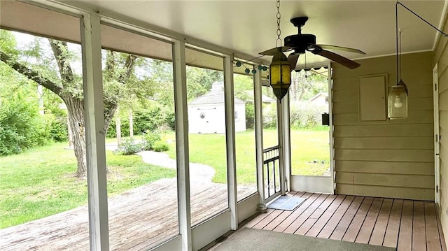 1441 S Maple St, Ottawa, KS 66067 - unfurnished sunroom featuring ceiling fan and healthy amount of natural light