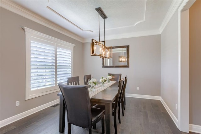 8721 N Mersington Ave, Kansas City, MO 64156 - dining area with ornamental molding, dark wood-style floors, a chandelier, and a textured ceiling