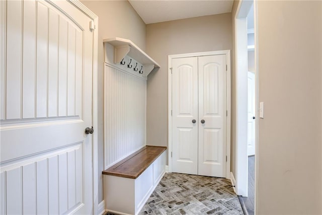 8721 N Mersington Ave, Kansas City, MO 64156 - mudroom with baseboards