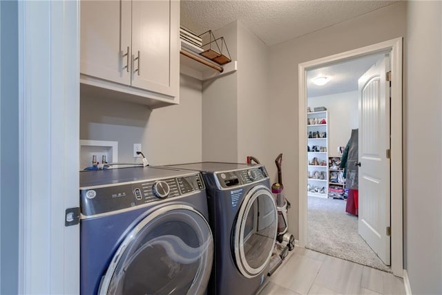 8721 N Mersington Ave, Kansas City, MO 64156 - laundry room featuring cabinet space, independent washer and dryer, a textured ceiling, and light colored carpet