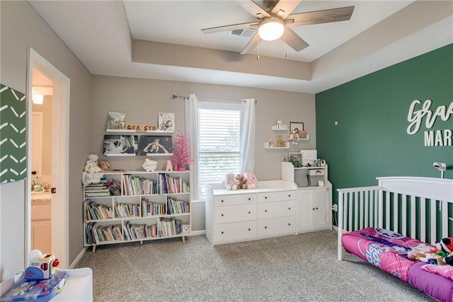 8721 N Mersington Ave, Kansas City, MO 64156 - bedroom with carpet floors, a raised ceiling, and ceiling fan