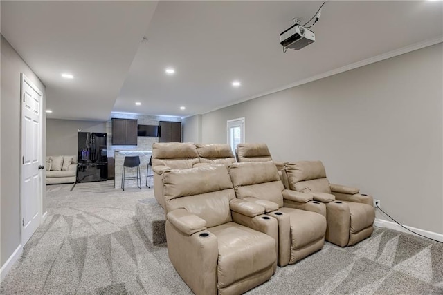 8721 N Mersington Ave, Kansas City, MO 64156 - cinema featuring light colored carpet, ornamental molding, and recessed lighting