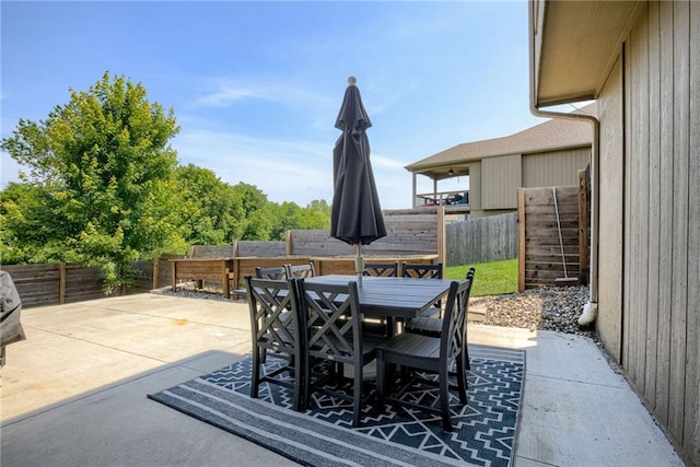 8721 N Mersington Ave, Kansas City, MO 64156 - fenced backyard with outdoor dining space and a patio area