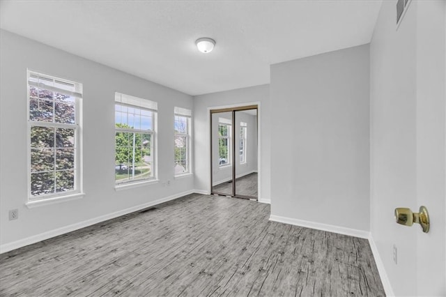 19420 E 13th St, Independence, MO 64056 - unfurnished room featuring wood finished floors and baseboards