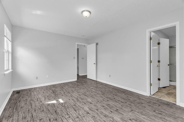 19420 E 13th St, Independence, MO 64056 - unfurnished room featuring wood finished floors and baseboards
