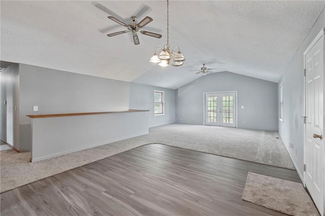 12 SW 365th Rd, Warrensburg, MO 64093 - unfurnished living room featuring ceiling fan, a textured ceiling, carpet flooring, vaulted ceiling, and wood finished floors