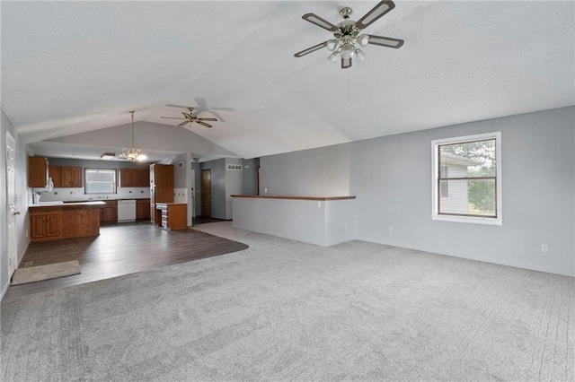 12 SW 365th Rd, Warrensburg, MO 64093 - unfurnished living room with ceiling fan, carpet flooring, lofted ceiling, plenty of natural light, and a textured ceiling