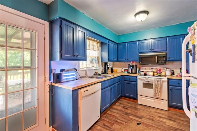 1405 S Vine St, Holden, MO 64040 - kitchen with white appliances, blue cabinets, light countertops, backsplash, and dark wood-style floors