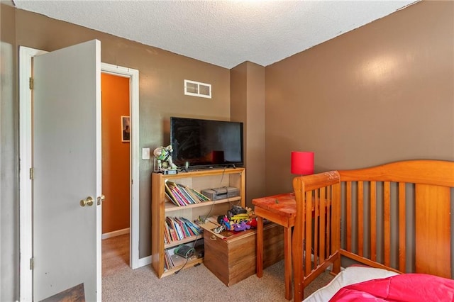 1405 S Vine St, Holden, MO 64040 - carpeted bedroom featuring a textured ceiling and baseboards