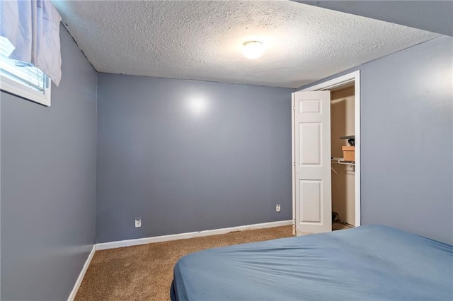 1405 S Vine St, Holden, MO 64040 - bedroom with carpet floors and a textured ceiling